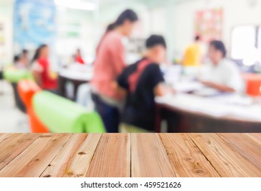 Look Out From The Table, Blur Image Of Parent And Student Found The Class Teacher As Background.