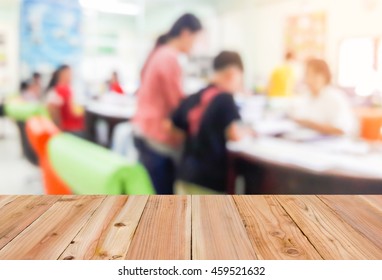 Look Out From The Table, Blur Image Of Parent And Student Found The Class Teacher As Background.