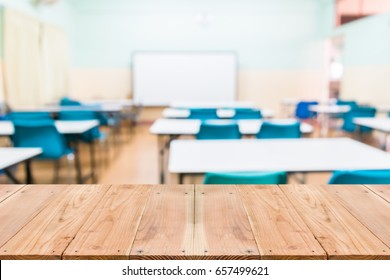 Look out from the table, blur image of empty classroom as background. - Shutterstock ID 657499621