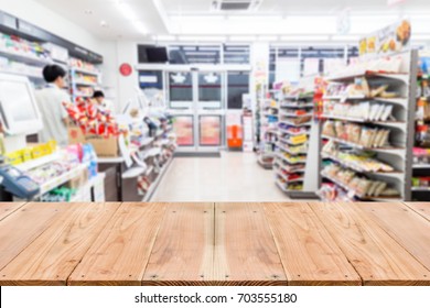 Look Out From The Table, Blur Image Of Inside The Convenience Store As Background.