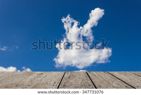 Look out from the table, cloud shaped like angel as background .