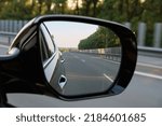 look in the rear view mirror of a car