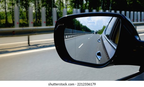 look in the rear view mirror of a car - Powered by Shutterstock