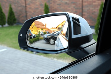 Look in the rear view mirror of a car. Look in the rear view mirror of car.