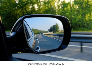 Look in the rear view mirror of a car - Powered by Shutterstock