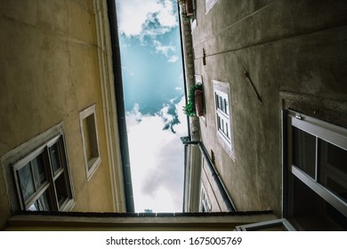 Look Of The Sky Inbetween Two Old City Buildings.