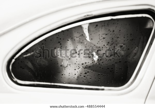 A\
look through the steamy windows at the kissing\
couple