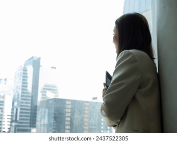 look at window businesswoman female lady girl person people human armcross tablet thinking idea strategy business copy space meeting technology working corporate office professional manager success  - Powered by Shutterstock