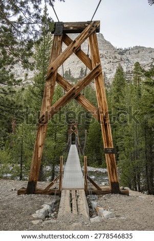 Looking Across Empty Swinging Bridge In Kings Canyon National Park