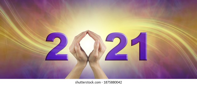 Looking Ahead Into 2021 - Female Hands Making The 0 Of 2021 On A Gold And Purple Swishing  Background With Plenty Of Copy Space
