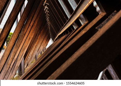 Looking Along Angled Timber Trusses And Beams Of A Cantilever Building, All Converging At A True Vanishing Point.
Creative Composition Of A Timbered Structure.