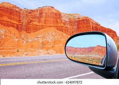 looking back in the car's rearview mirror the Capitol Reef Rocky Mountains near escalante utah on route 12 in the united states - Powered by Shutterstock
