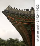 Looking up to Beautiful korean Traditional architecture colorful wooden carved pagoda roof