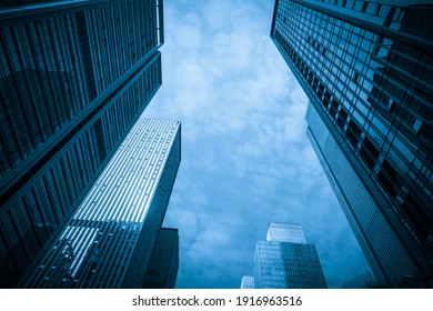 Looking Up Blue Modern Office Building - Shutterstock ID 1916963516