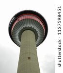 looking up at the calgary tower on a cloudy day in calgary, alberta,  canada