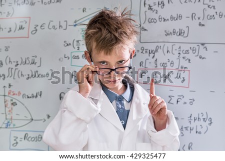 Similar – Happy kid looking at camera through magnifying glass