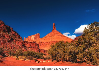 Looking up to Castle Rock, also called Castleton Tower, a large sandstone pillar in the town of Castle Valley, located on the Colorado River northwest of Moab, Utah, United States.