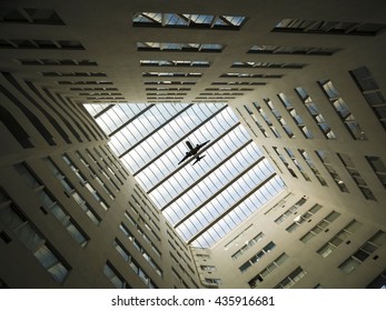 Looking up ceiling window inside modern building