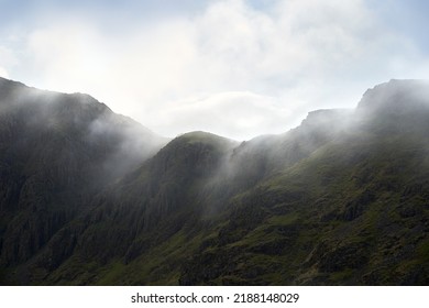 Looking up at Chapel Crags, ridge,  below High Stile as cloud rolls over the ridge in the Autumn in the Lake District, UK. - Shutterstock ID 2188148029