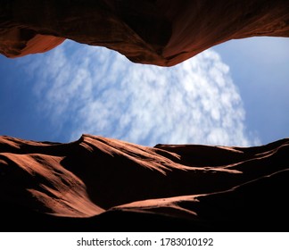 Looking up to the clouds and blue sky from inside Antelope Canyon in Page, AZ. 