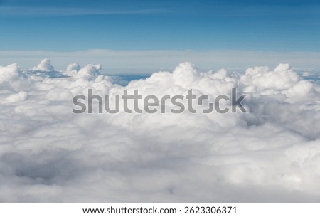 Looking at the clouds and sky on the plane