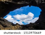 Looking at the clouds through the hole of a cave in Lake Myvatn, Iceland