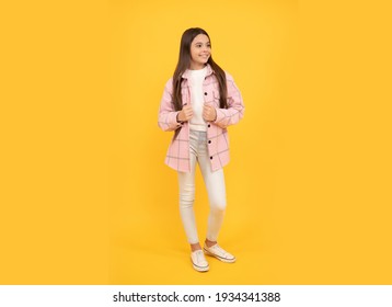 looking cool. latest trend. autumn fashion. happy teen girl in pink checkered shirt. smiling hipster kid casual style. tween child wear plaid shirt. chequered flannel jacket. beauty and fashion.