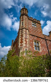 Looking up to corner tower of building