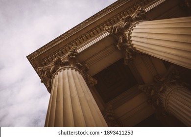 Looking up at the Courthouse Pillars in the Museum District of Washington D.C with an overcast sky - Shutterstock ID 1893411253