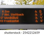 Looking up to departure board at tram station named Bahnhofstrasse at Swiss City of Zürich on a foggy autumn day. Photo taken November 7th, 2024, Zurich, Switzerland.