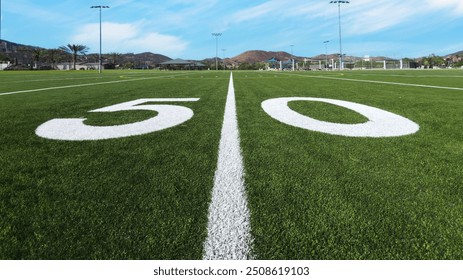 Looking down the 50 yard line on American football field - Powered by Shutterstock