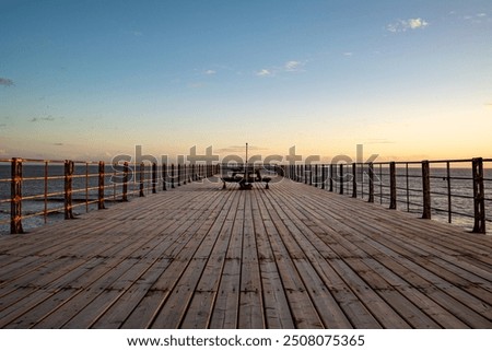 looking down bognor pier after sunset