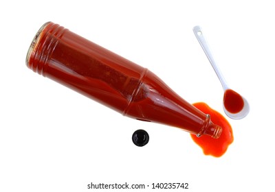 Looking Down At A Bottle Of Hot Sauce Spilling.