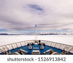 Looking down at the bow of ship trapped in ice
