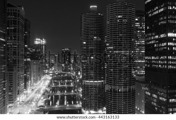 Looking down the Chicago River at night in\
Chicago, Illinois in black and\
white.