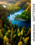 Looking down from the Pähkänäkallio cliff at the Kitkajoki river meandering through the Taiga forests of Oulanka National Park in Kuusamo, Finland on an early summer morning