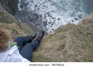 Looking down the Cliffs of Moher in Ireland on a gloomy day