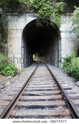 looking down a dark train tunnel