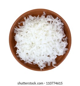 Looking Down At A Dish Of Shredded Coconut.