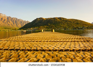 Looking Down A Jetty Onto Deer Park Heights In Queenstown, New Zealand