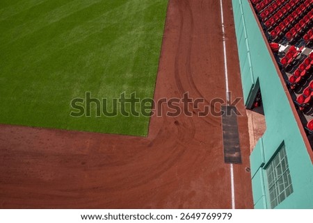 looking down at the Left Field corner and warning track from above Green Monster, Fenway Park, Boston Red Sox, green grass, brown dirt