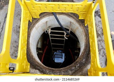 looking down a manhole into a cable vault