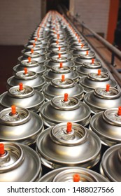 Looking Down On Aerosol Cans On Factory Production Line