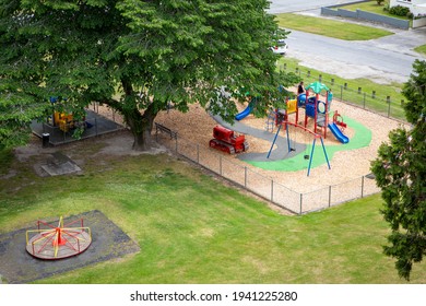 Looking down on the colourful playground and park area from the walkway above, Roxburgh, Central Otago, New Zealand
