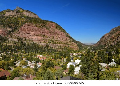 looking down on the historic mining town of ouray in the san juan mountains of colorado on a sunny fall day, from the start of the million dollar highway