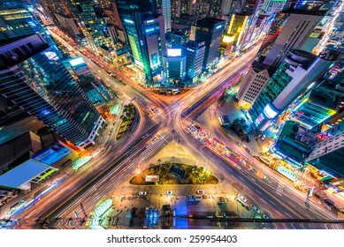 Looking Down On A Major Interstection At Night In Seoul, South Korea.