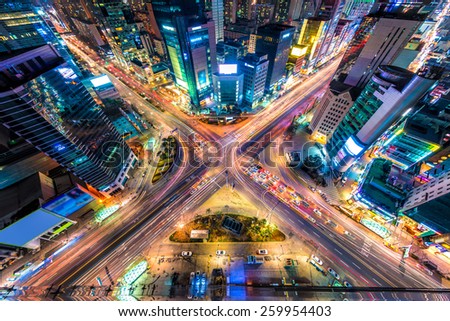 Looking down on a major interstection at night in Seoul, South Korea.