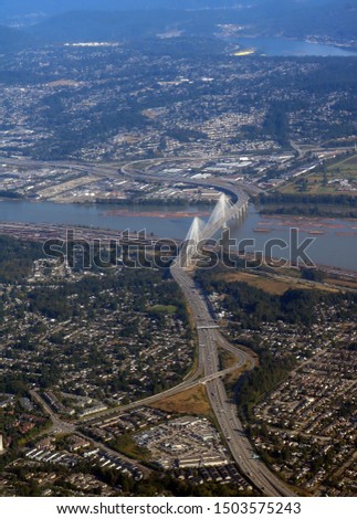 Looking down on Trans Canada Highway One and the Port Mann Bridge over the Fraser River in Vancouver British Columbia August 2019