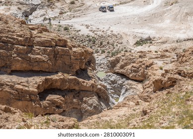 Looking down on two small pools of water near Nahal Rahaf-Rahaf Stream in the Judean Desert in Israel.
