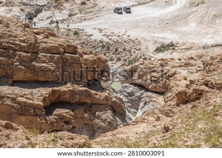 Looking down on two small pools of water near Nahal Rahaf-Rahaf Stream in the Judean Desert in Israel.
